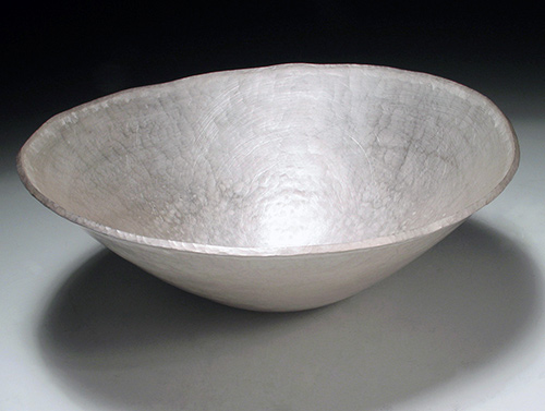 A forged fine silver bowl